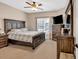 Spacious bedroom featuring a ceiling fan, large window, and an ensuite bathroom at 850 Highland Bend Cv, Alpharetta, GA 30022