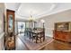 Formal dining room boasts a tray ceiling, chandelier, and space for large gatherings at 850 Highland Bend Cv, Alpharetta, GA 30022