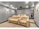 Home theater features recliner seating, projector, and sconce lighting at 850 Highland Bend Cv, Alpharetta, GA 30022