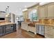 Spacious kitchen featuring a copper sink, custom cabinets, and stainless steel appliances at 850 Highland Bend Cv, Alpharetta, GA 30022