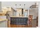 Kitchen island with seating, granite countertops, and stainless steel appliances at 850 Highland Bend Cv, Alpharetta, GA 30022