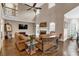 Open living room with high ceilings, a fireplace, and expansive hardwood floors at 850 Highland Bend Cv, Alpharetta, GA 30022