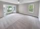 Large bedroom features a bay window and carpeted floor at 8608 Creekview Ct, Douglasville, GA 30135