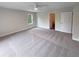 Bright bedroom with carpeted floor and lots of natural light from the window at 8608 Creekview Ct, Douglasville, GA 30135