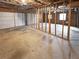 Large garage with an open ceiling, a framed wall, a white door, and a concrete floor at 8608 Creekview Ct, Douglasville, GA 30135