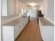 Stylish kitchen with granite countertops, white cabinets, and stainless steel appliances at 8608 Creekview Ct, Douglasville, GA 30135