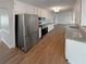 Spacious kitchen with stainless steel appliances, granite countertops, and wood floors at 8608 Creekview Ct, Douglasville, GA 30135