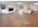 Inviting living room featuring a fireplace, hardwood floors, and lots of natural light at 8608 Creekview Ct, Douglasville, GA 30135