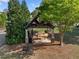 Community picnic and seating area featuring covered tables and a charcoal grill at 1338 Dupont Nw Park, Atlanta, GA 30318