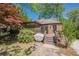 Backyard with a deck, mature trees, and a lush garden, creating a private outdoor oasis at 1884 Montrose Dr, East Point, GA 30344