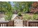Private backyard view with a basketball court and storage shed at 1884 Montrose Dr, East Point, GA 30344