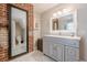 Elegant bathroom with a large mirror, gray cabinets, and marble floors at 1884 Montrose Dr, East Point, GA 30344