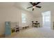 Playful bedroom with a toy kitchen, drum set, and ample natural light at 1884 Montrose Dr, East Point, GA 30344