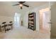 Bedroom featuring large windows, a bookshelf, and an attached full bath at 1884 Montrose Dr, East Point, GA 30344