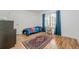 Cozy bedroom with hardwood floors, a single bed, and a window with natural light at 1884 Montrose Dr, East Point, GA 30344