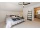 Bright bedroom with ceiling fan, full-length mirror and easy access to the full bath at 1884 Montrose Dr, East Point, GA 30344