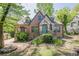 Charming brick home with stone accents, well-maintained lawn, and inviting curb appeal at 1884 Montrose Dr, East Point, GA 30344