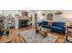 Inviting living room with fireplace, a comfortable blue couch, and decorative accents at 1884 Montrose Dr, East Point, GA 30344