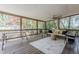Relaxing screened porch with comfortable seating and a view of the backyard at 1884 Montrose Dr, East Point, GA 30344