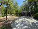 Image shows a backyard shed with a concrete pad and double doors, perfect for storage and hobbies at 1884 Montrose Dr, East Point, GA 30344