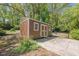 A backyard storage shed with a ramp and concrete foundation at 1884 Montrose Dr, East Point, GA 30344