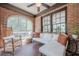 Inviting sunroom with brick features and comfortable seating, perfect for relaxation at 1884 Montrose Dr, East Point, GA 30344