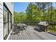 Spacious back deck features a dining table and grill for outdoor entertaining at 1961 Flowering Dr, Grayson, GA 30017