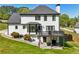 An expansive backyard featuring a deck, a patio and lush green grass at 1961 Flowering Dr, Grayson, GA 30017