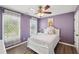 Charming bedroom features a large window and a ceiling fan at 1961 Flowering Dr, Grayson, GA 30017