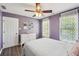 Charming bedroom features a large window, a ceiling fan and great light at 1961 Flowering Dr, Grayson, GA 30017