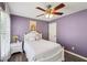 Charming bedroom features a large window and a ceiling fan at 1961 Flowering Dr, Grayson, GA 30017