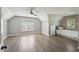 Spacious bedroom with vaulted ceilings, plank accent wall, and large windows at 1961 Flowering Dr, Grayson, GA 30017