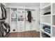 Walk-in closet features custom shelving, drawers, and plenty of storage space at 1961 Flowering Dr, Grayson, GA 30017