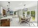 Open dining room featuring stainless steel appliances and natural light at 1961 Flowering Dr, Grayson, GA 30017