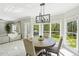 Open dining room features a modern light fixture and natural light at 1961 Flowering Dr, Grayson, GA 30017