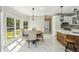 Open dining room features a modern light fixture and natural light at 1961 Flowering Dr, Grayson, GA 30017