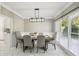 Bright dining room features large windows, modern light fixture and marble flooring at 1961 Flowering Dr, Grayson, GA 30017
