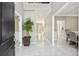 Elegant foyer featuring marble floors, neutral paint, and a clear view of the home's layout at 1961 Flowering Dr, Grayson, GA 30017