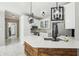 Bright kitchen with white cabinetry, marble tile floors, island with quartz countertops, and stainless steel appliances at 1961 Flowering Dr, Grayson, GA 30017