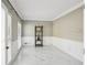 Living room featuring marble flooring and wainscotting at 1961 Flowering Dr, Grayson, GA 30017