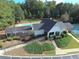 An aerial view of a community pool, tennis courts, and clubhouse at 1961 Flowering Dr, Grayson, GA 30017
