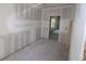 Bedroom with unfinished walls, an open entryway, and a view from the window at 3689 Ashwood Se Dr, Smyrna, GA 30080