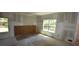Large bedroom featuring unfinished walls, flooring and windows offering a sunny view at 3689 Ashwood Se Dr, Smyrna, GA 30080