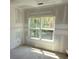Unfinished bedroom with a window overlooking the trees at 3689 Ashwood Se Dr, Smyrna, GA 30080
