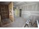 Living room with visible framing for a modern design and unfinished walls at 3689 Ashwood Se Dr, Smyrna, GA 30080