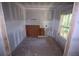 Room under construction with window, drywall, unfinished floors and electrical wiring at 3689 Ashwood Se Dr, Smyrna, GA 30080