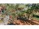 Aerial view of a property featuring a well-maintained landscape, lush trees, and a serene, private setting at 1183 Woods Ne Cir, Atlanta, GA 30324