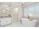 Relaxing bathroom featuring a modern soaking tub, a walk-in shower, and a granite vanity at 1183 Woods Ne Cir, Atlanta, GA 30324