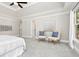 Large bedroom with a ceiling fan, and lots of natural light from the wall of windows at 1183 Woods Ne Cir, Atlanta, GA 30324