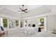 Spacious bedroom featuring tray ceilings, generous natural light, and neutral-toned walls and flooring at 1183 Woods Ne Cir, Atlanta, GA 30324